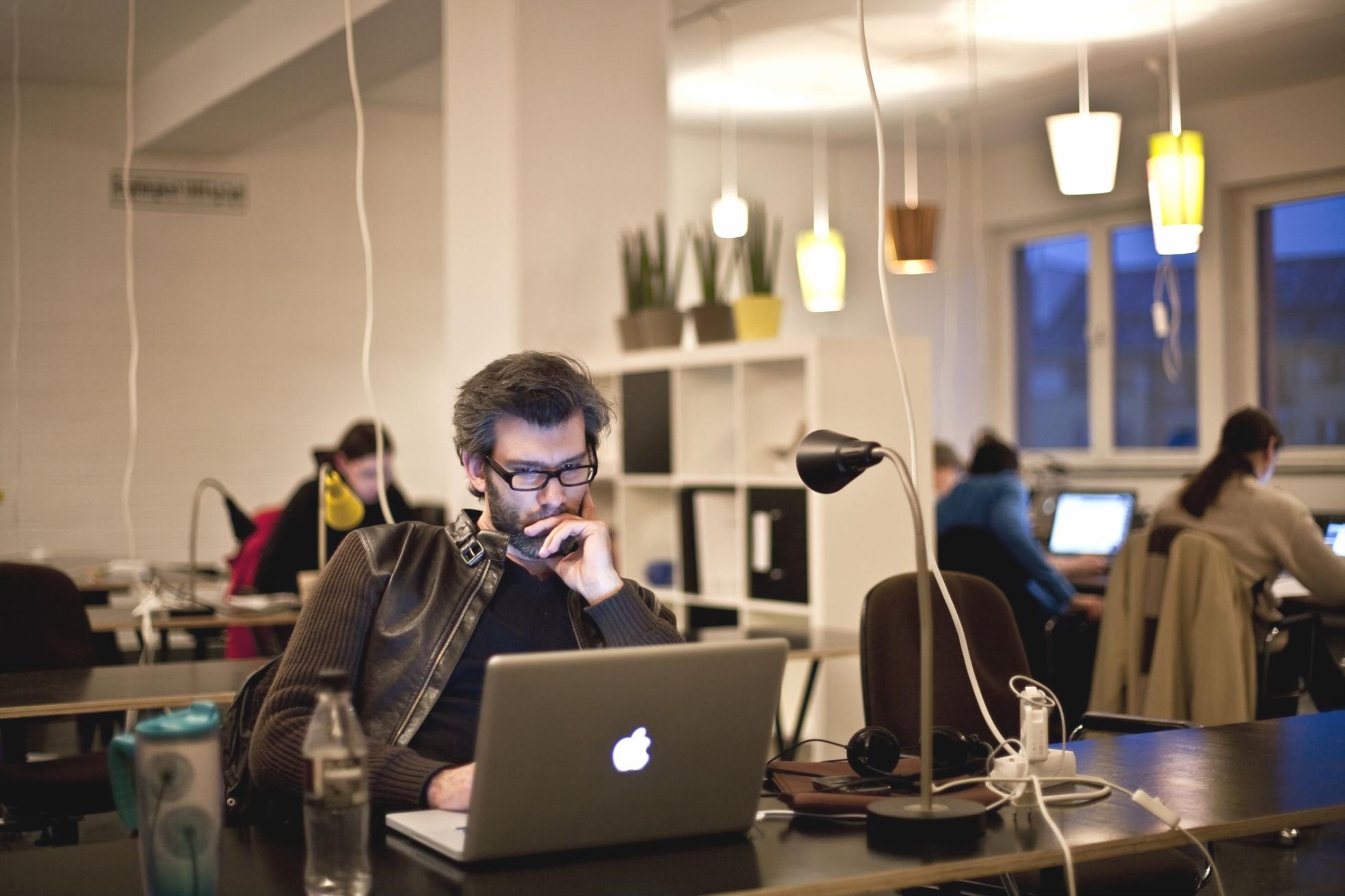 Hands working through financial planning materials